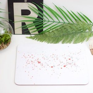 Orange paint splatter melamine and cork backed placemat