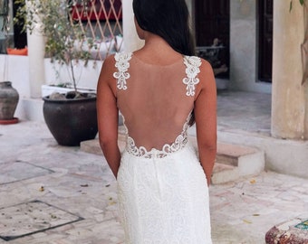 Luxurious Lace Boho Style Wedding Dress Featuring Beaded Lace Deep Plunge Neckline, Open Back and Long Lace Train