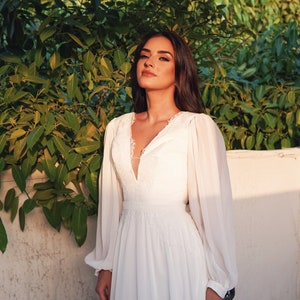 Romantic Bohemian Style A-line Chiffon Wedding Dress with Deep neckline, Long Sleeves and Open Back
