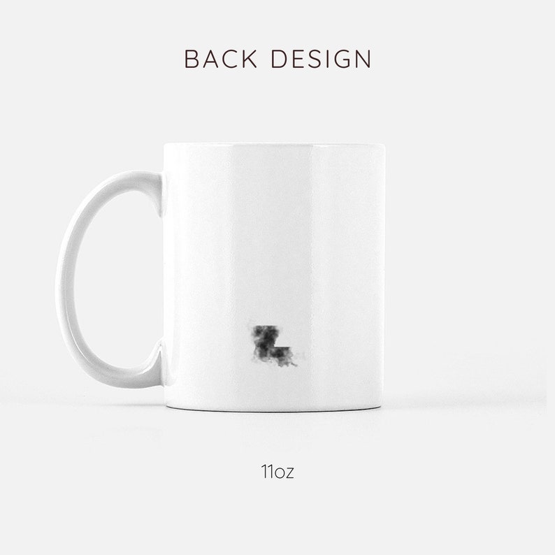 May include: White ceramic mug with a black outline of the state of Louisiana. The mug is 11 ounces.
