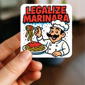 May include: A square sticker with a cartoon chef holding spaghetti with tomato sauce. The text "LEGALISE MARINARA" is in red and white. The chef has a large moustache and wears a white chef's hat and coat.