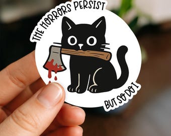 The Horrors Persist But So Do I Cat Sticker – Creepy Cute Black Cat with Axe, Gothic Dark Humor Vinyl Decal