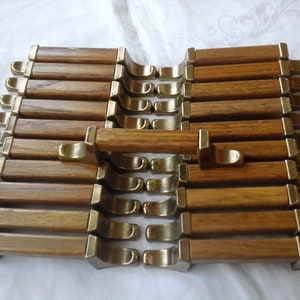 21 oak wood and brass finish metal drawer pulls or cupboard handles 3 inch centers 5 inch total length dated 1981