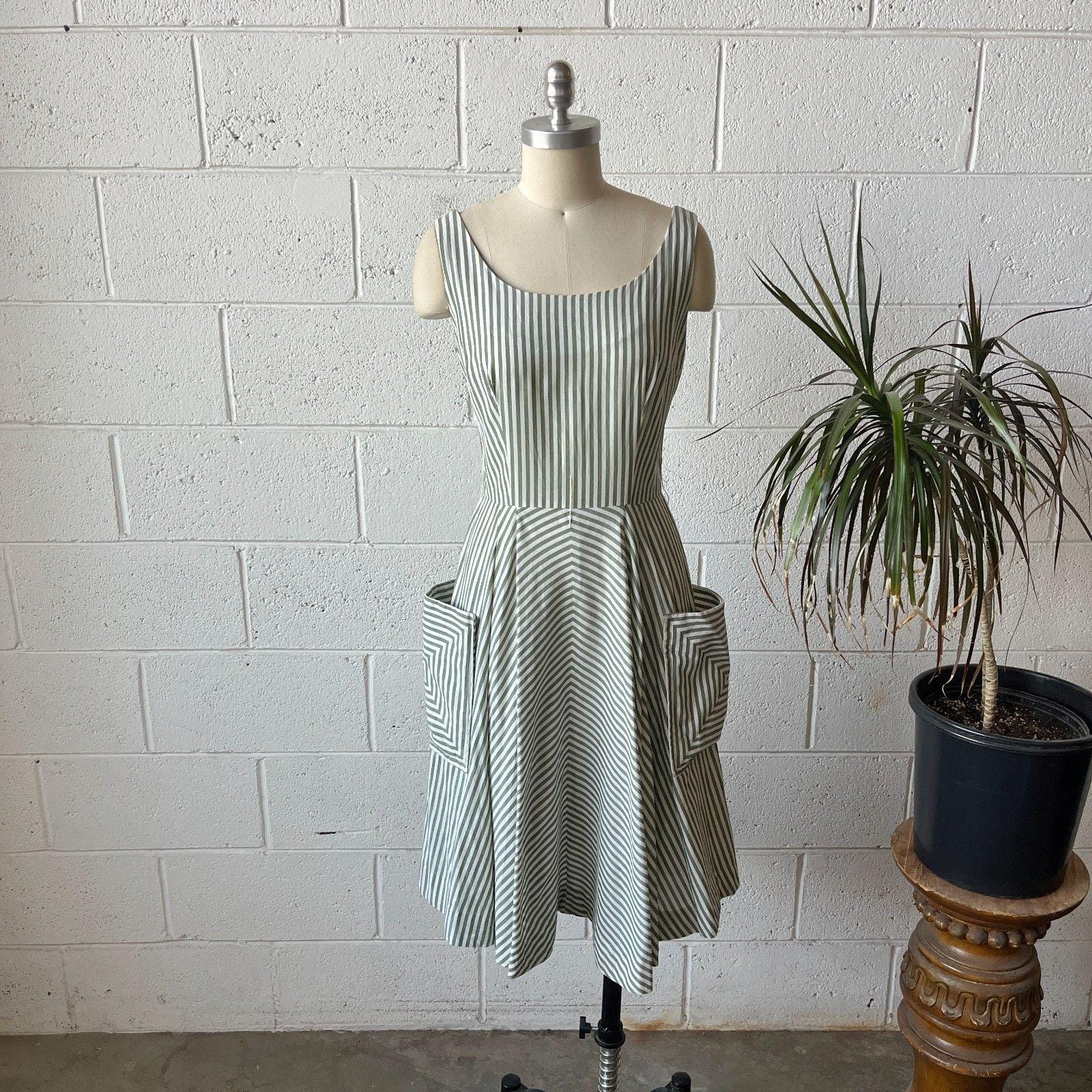 green agua bendita dress Forest Green Sparkly Crossover Bust Bardot Style 50s Swing Dress – Pretty  Kitty Fashion main image 1