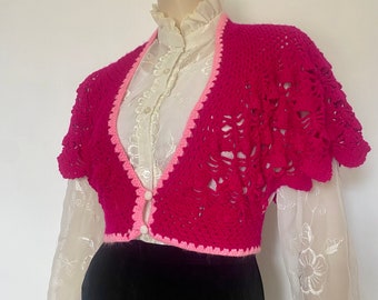 Crochet pink cropped cardigan with flared short sleeves