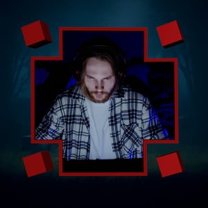 May include: A person wearing a plaid shirt and headphones is sitting in front of a computer screen. The person is looking down at the screen. The image is framed in a red square with red squares in the corners.
