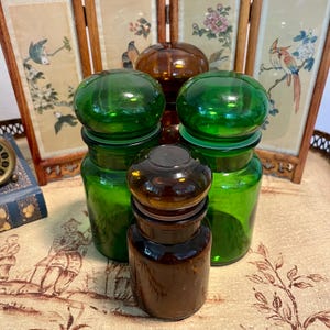 Vintage Apothecary Jars – Set of 4 | Green & Amber Glass Storage with Mushroom Lids | Mid-Century Pharmacy Decor