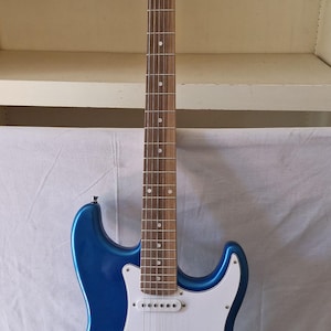 Vision electric guitar (MSA Blue) with its carrying case
