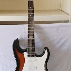Voodoo electric guitar with carrying case