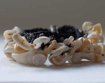 Hand made black crochet bracelet with glass beads and beautiful shells. Shell jewellery made in Thailand by hand.