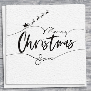 Biglietto di auguri di Natale per il figlio, disegno con scritti disegnati a mano, dettaglio della slitta di Babbo Natale e delle renne, auguri personalizzati