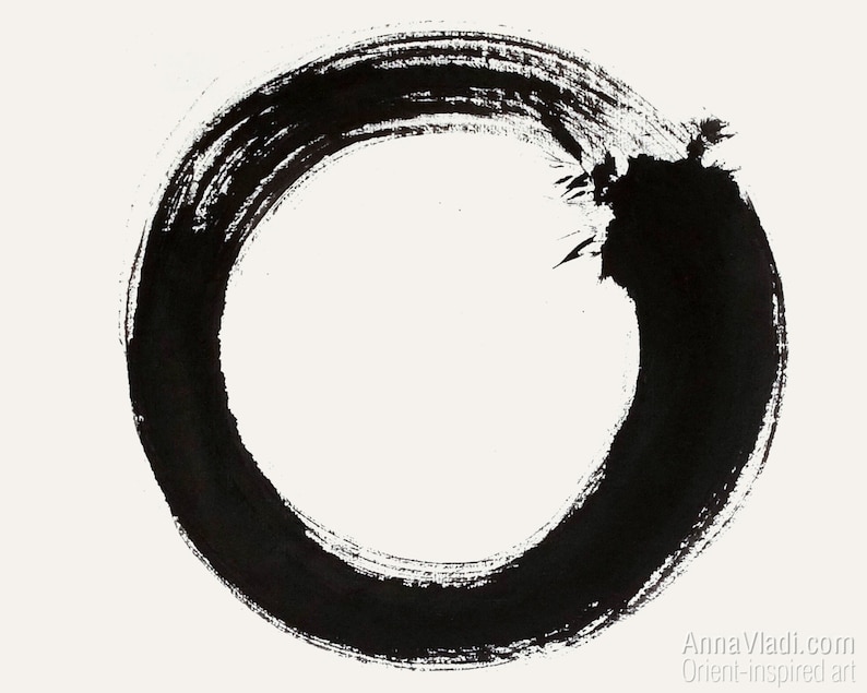 May include: A black ink circle drawn on a white background. The circle is incomplete, with a break in the line at the top.