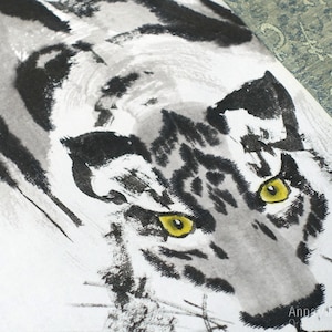 May include: A black and white ink painting of a tiger's face with yellow eyes. The tiger is depicted in a realistic style with detailed fur and whiskers.