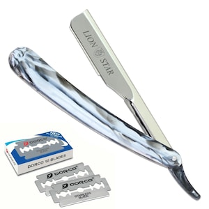 May include: A straight razor with a silver blade and a handle with a white and gray marbled design. The razor is labeled "LION STAR". A box of "DORCO 10 BLADES" and several stainless steel blades are also included.