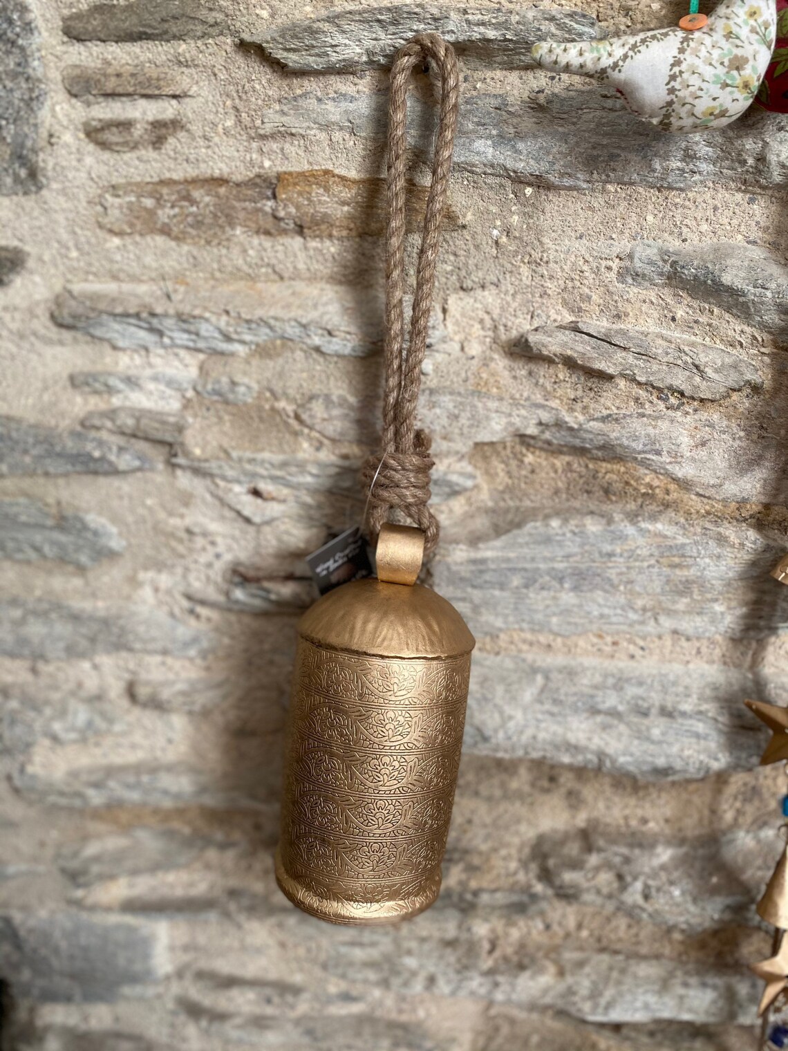 Antiqued gold effect cow bell with jute string Etsy