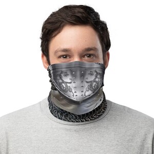 May include: A gray and silver face mask with a knight's helmet design. The mask features a chainmail pattern and a dragon design on the helmet.