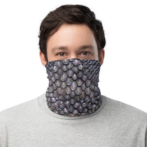 May include: A gray and silver face mask with a scale pattern. The mask is made of a soft, breathable fabric and is designed to be comfortable to wear.