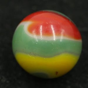 May include: A colorful glass marble with a vibrant design. The marble features bands of red, green, and yellow, creating a visually appealing pattern. The marble is a classic toy, perfect for collectors or for play.