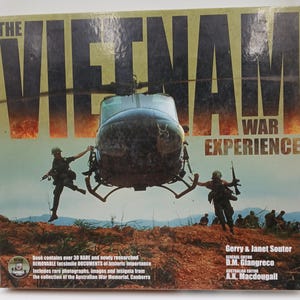 May include: A book titled "The Vietnam War Experience" with a helicopter and soldiers in the background. The cover features the title in large, bold letters and includes text about the book's contents and authors.