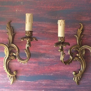Stamped bronze wall lights