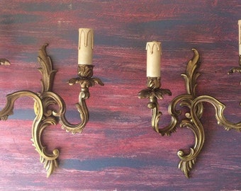 Stamped bronze wall lights