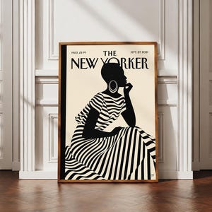 Peut inclure: Une impression encadrée de la couverture du magazine The New Yorker datée du 27 septembre 2021. L'illustration montre une personne aux cheveux courts portant une robe à rayures noires et blanches, de grandes créoles, le menton sur la main.