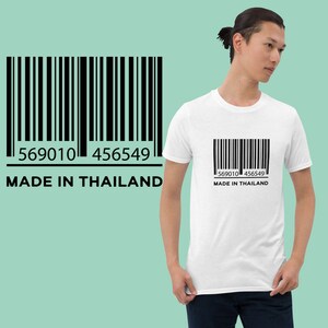 May include: White t-shirt with a black barcode and the text "569010 456549 MADE IN THAILAND"