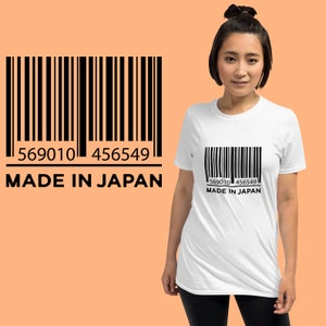 May include: White t-shirt with a black barcode and the text "569010 456549 MADE IN JAPAN" printed on the front.