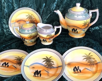 Antique Lustre Egyptian Revival Desert Scene Tea Set, 1920s: Teapot, Sugar, Creamer, and Three Dessert Plates