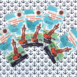 May include: Five vintage Texaco cruising charts, each with a different number and location. The charts are printed on paper and feature a red and white lighthouse with a green background. The charts are titled "Texaco Cruising Chart" and each chart has a different number. The charts are from the 1958 edition.
