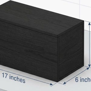 May include: A white ceramic mug with a black handle and the text "But First, Coffee" in a black, handwritten-style font. The mug is on a white surface.