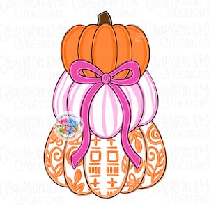 May include: A stacked pumpkin design with an orange top, pink and white striped middle, and orange patterned bottom. A bright pink bow adorns the middle pumpkin. The design is a fall or harvest theme.