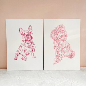 May include: Two illustrations of dogs, a French Bulldog and a Poodle, drawn in pink ink on white paper.