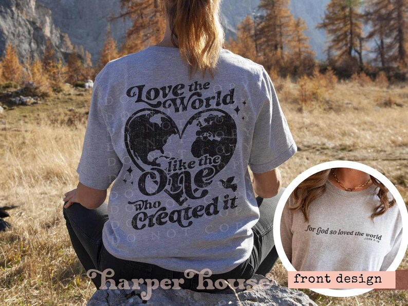 May include: A grey t-shirt with a black graphic on the back that says "Love the World like the One Who Created it" with a world map inside a heart. The front of the shirt has the text "for God so loved the world" in black.
