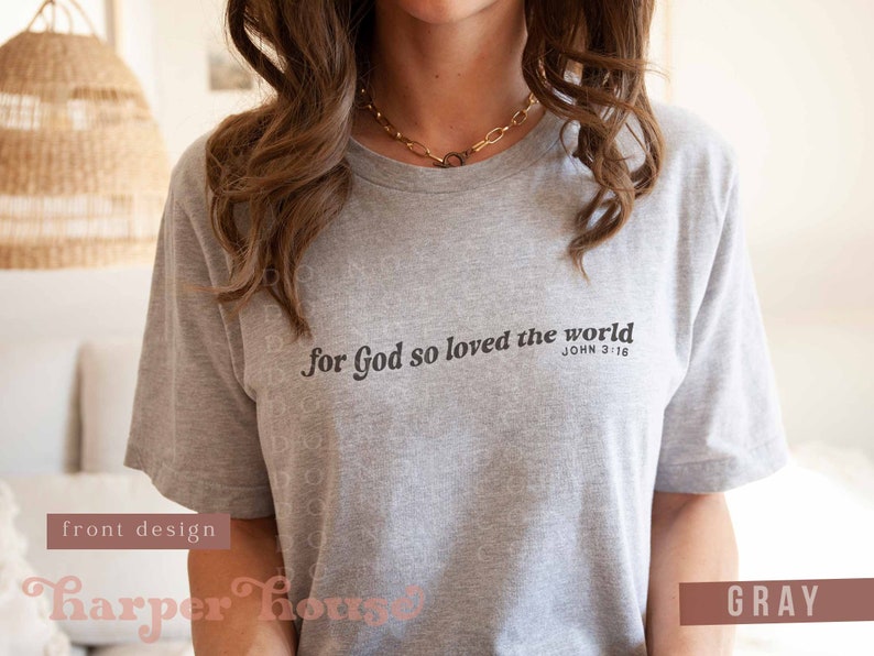 May include: Grey t-shirt with the text "For God so loved the world" and the Bible verse "John 3:16" printed on the front.