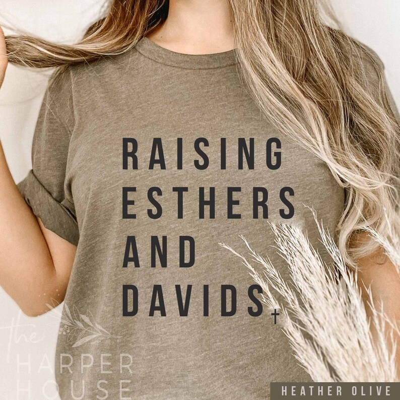 May include: A green t-shirt with the text "Raising Esthers and Davids" printed on it.