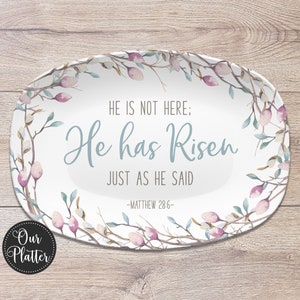 May include: White oval platter with a floral design featuring branches with pink blossoms and green leaves. The platter has the text "HE IS NOT HERE; He has Risen JUST AS HE SAID -MATTHEW 28:6-"