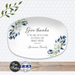 May include: White oval platter with floral accents and the text "Give thanks." The design includes blue and white watercolor flowers and the scripture Psalm 136:1. The platter also includes the text "Stevenson Family."
