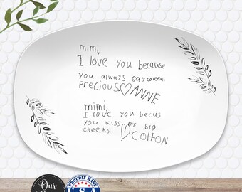 May include: White oval platter with handwritten text that reads "mimi, I love you because...Precious ANNE...mimi, I love you becus...big COLTON." The platter has black leaf designs and a "Proudly Made U.S.A." sticker.