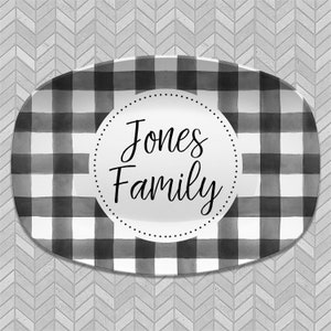 May include: Black and white checkered oval serving platter with a white circle in the center that says "Jones Family".