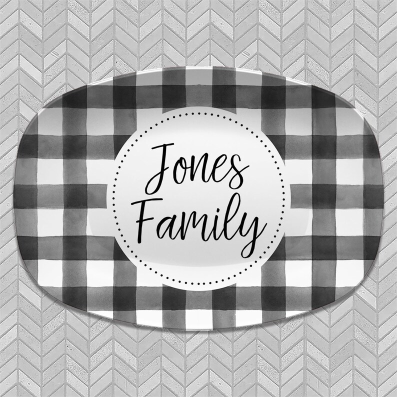 May include: Black and white checkered oval serving platter with a white circle in the center that says "Jones Family".