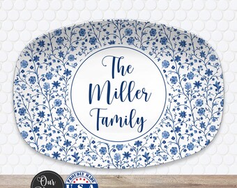 May include: Oval platter with a white background and a blue floral pattern. The center circle has the text "The Miller Family" in blue script. The platter has a decorative border and is labeled "Our Platter" and "Proudly Made U.S.A."