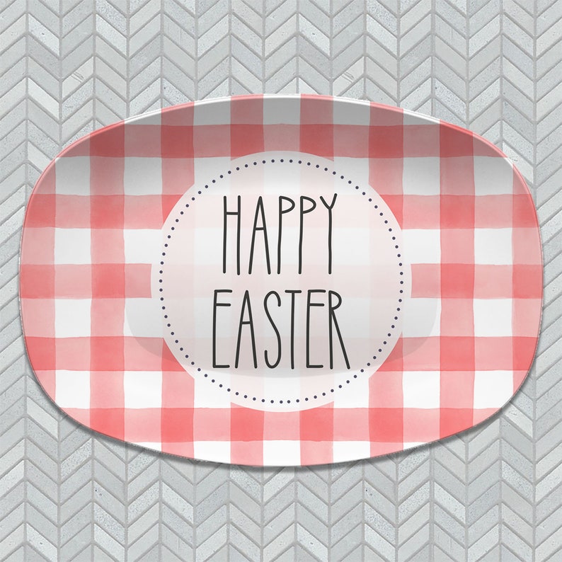 May include: A white oval serving platter with a red and white gingham pattern. The center of the platter has a circle with the text "Happy Easter" in black.