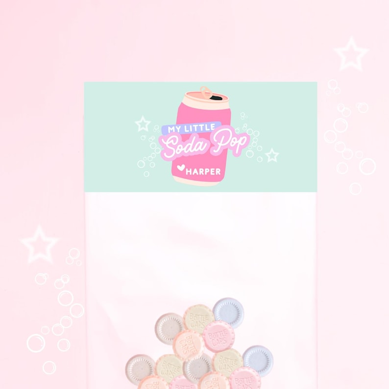 May include: A clear cellophane bag filled with pastel-colored candies. The bag has a light blue header with a pink soda can graphic and the text "MY LITTLE Soda Pop HARPER". The background is light pink with star and bubble graphics.