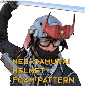 May include: A person wearing a red and grey samurai helmet with a black face mask and holding a toy gun. The text "NEO-SAMURAI HELMET FOAM PATTERN" is written in yellow on the image.