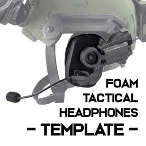May include: Close-up of a tactical headset with a microphone attached. The headset is black and gray, with the words "FOAM TACTICAL HEADPHONES - TEMPLATE -" in bold, black text.
