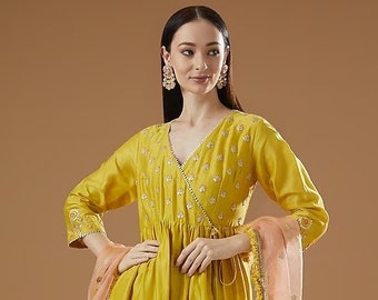 Featuring a yellow angrakha kurta  with gota patti embroidery. It is paired with matching gharara pants and a contrasting organza dupatta