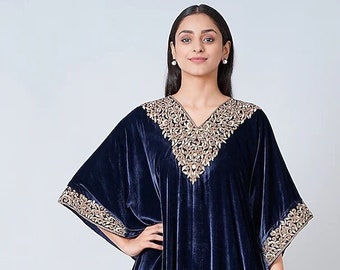 Featuring a blue maxi kaftan in silk velvet base with embroidery