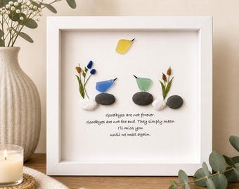 May include: A framed artwork featuring colorful glass birds and plants on a white background. The artwork includes the text "Goodbyes are not forever. Goodbyes are not the end. They simply mean I'll miss you until we meet again."