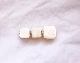 Square barrette in white mother-of-pearl and rhinestones